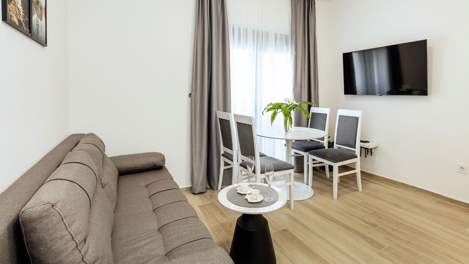 Bright dining corner with table and chairs in the apartment near the Adriatic coast.